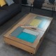 Table basse relevable dessus métal